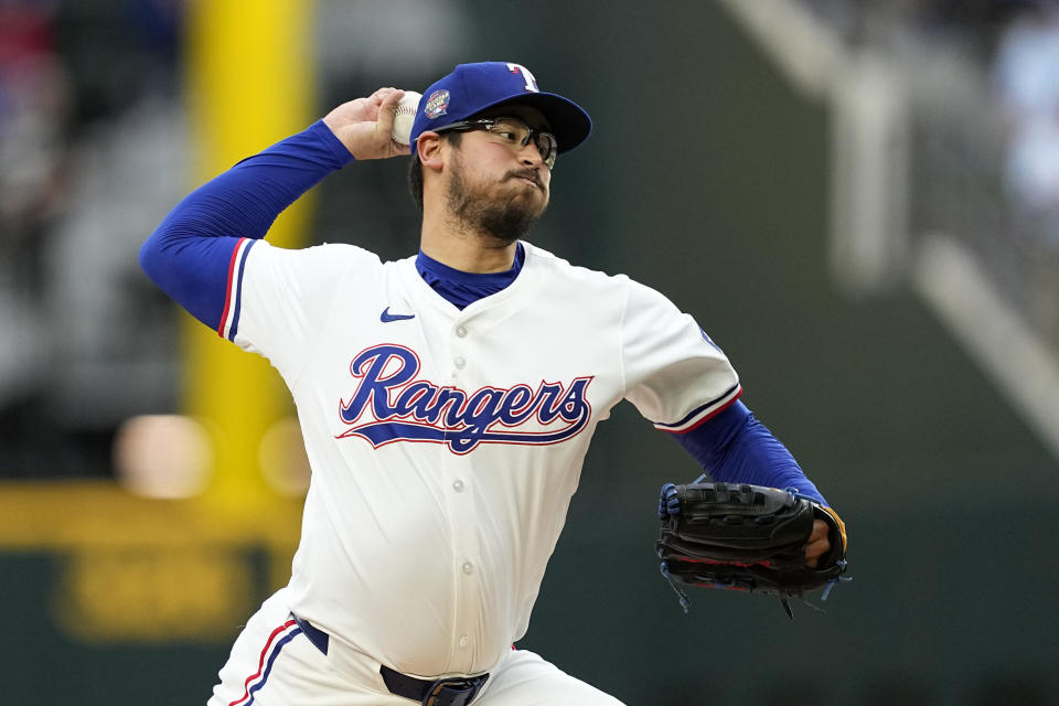 Texas Rangers starting pitcher Dane Dunning throws to the Seattle Mariners in the first inning of a baseball game in Arlington, Texas, Tuesday, April 23, 2024. (AP Photo/Tony Gutierrez)