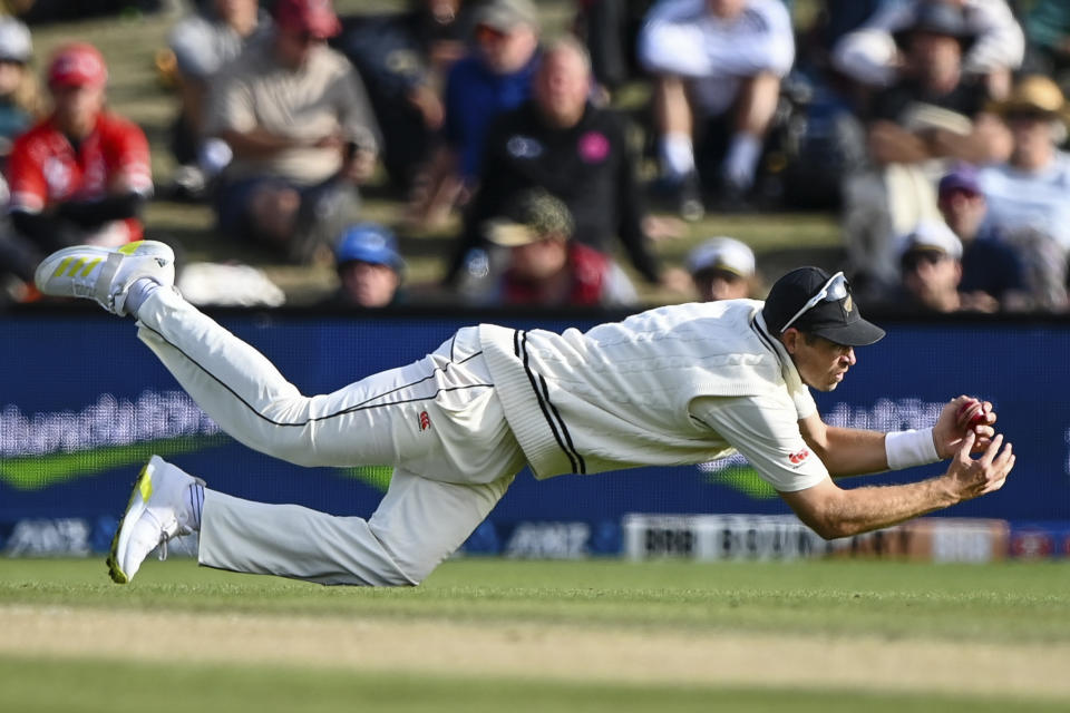 New Zealand's Tim Southee dives to take a catch to dismiss Australia's Usman Khawaja on day three of the second cricket test between New Zealand and Australia in Christchurch, New Zealand, Sunday, March 10, 2024. (John Davidson/Photosport via AP)