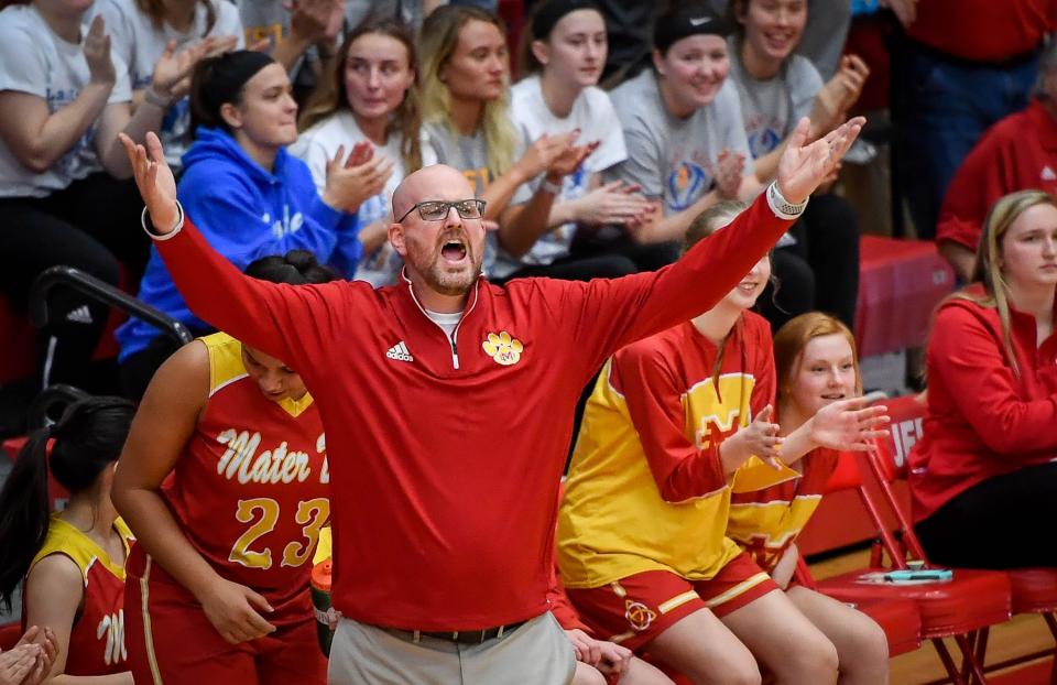 Mater Dei head coach Chad Breeden  reacts to action on the floor as the Evansville Mater Dei Wildcats play the Winchester Community Golden Falcons in the Class 2A Girls Semi-State Tournament at Jeffersonville High School Saturday, February 16, 2019.