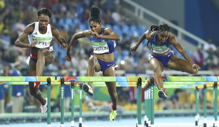 2016 Rio Olympics - Athletics - Final - Women's 100m Hurdles Final - Olympic Stadium - Rio de Janeiro, Brazil - 17/08/2016. (From L) Cindy Ofili (GBR) of Britain, Kristi Castlin (USA) of USA and Brianna Rollins (USA) of USA compete. REUTERS/Lucy Nicholson