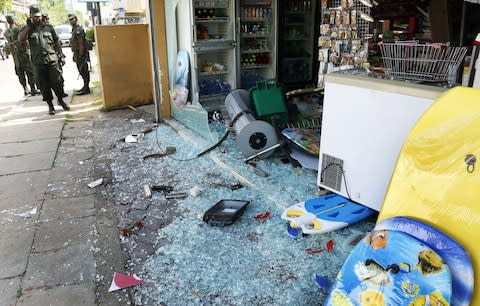 Shops were vandalised in the violence - Credit: REX