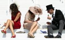 Racegoers enjoy a spot of lunch ahead of the day's horse racing during the second day of the Epsom Derby Festival, in Surrey, southern England, on June 4, 2011. The Queen's horse, Carlton House, ridden by Ryan Moore, is seeking to be the first Derby winner owned by a reigning monarch since Minoru won in 1909 for King Edward VII. AFP PHOTO / ADRIAN DENNIS (Photo credit should read ADRIAN DENNIS/AFP/Getty Images)