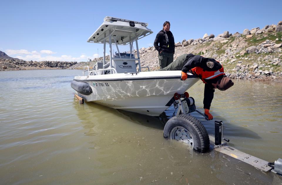 Utah State Parks rangers Charity Owens and Cade Pies attach a boat to a trailer during boat operator training at the Great Salt Lake State Park marina in Magna on Wednesday, April 19, 2023. | Kristin Murphy, Deseret News