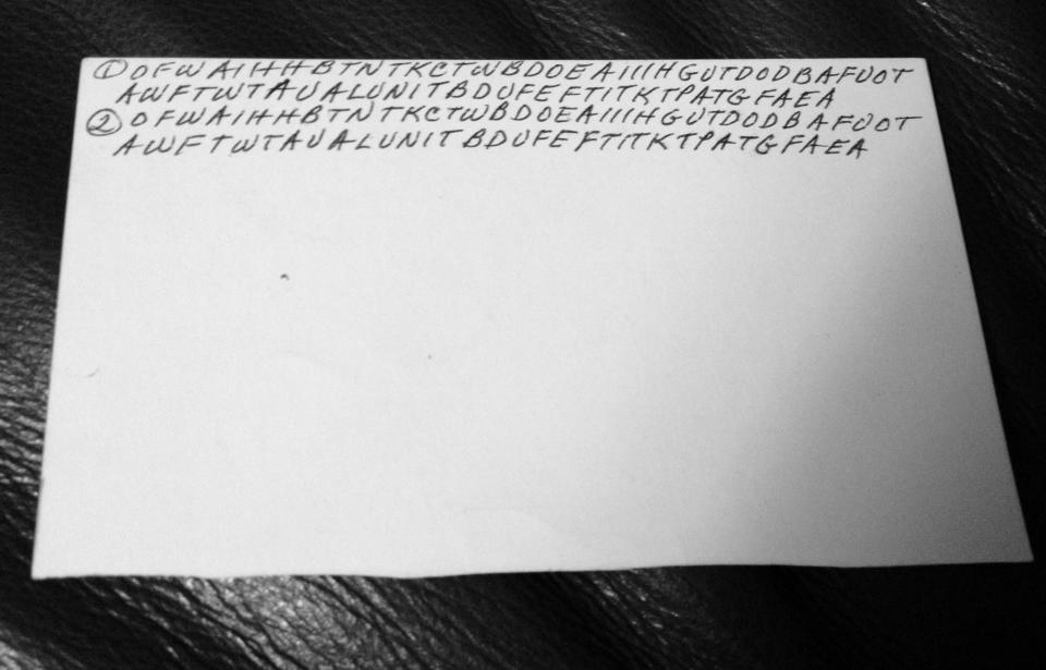 This undated family photo shows the back of an index card filled with letters written by Dorothy Holm. A brain tumor took away Holm's ability to speak, she picked up index cards and began filling them with seemingly random, indecipherable sequences of letters. Her grandchildren saw her scribbling and thought she was leaving them a code, but it was one the preteens couldn't crack. Her granddaughters, 18 years later, were able to solve the code with help from the Internet community. (AP Photo/Courtesy of Janna Holm)