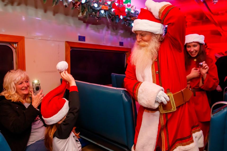 Santa Claus visits passengers on Oklahoma City's "The Polar Express" Train Ride, produced by Rail Events Productions, Thursday, Nov. 10, 2022. Based on the beloved book and movie, the holiday rides continue through Dec. 27 out of the Oklahoma Railway Museum in Oklahoma City.