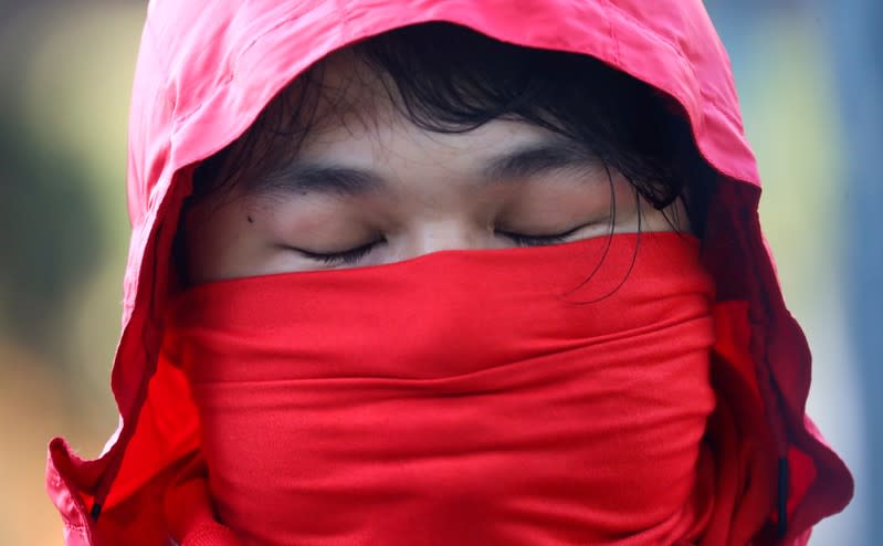 A protester reacts as he addresses the media at the Polytechnic University in Hong Kong