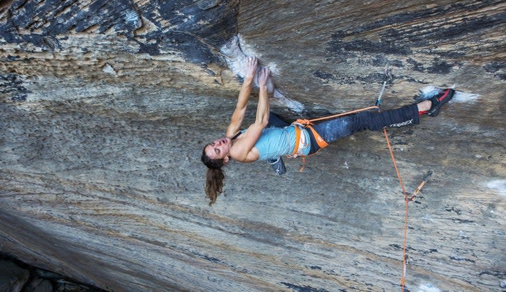 Woman climber on rock climb Red River Gorge, Kentucky.