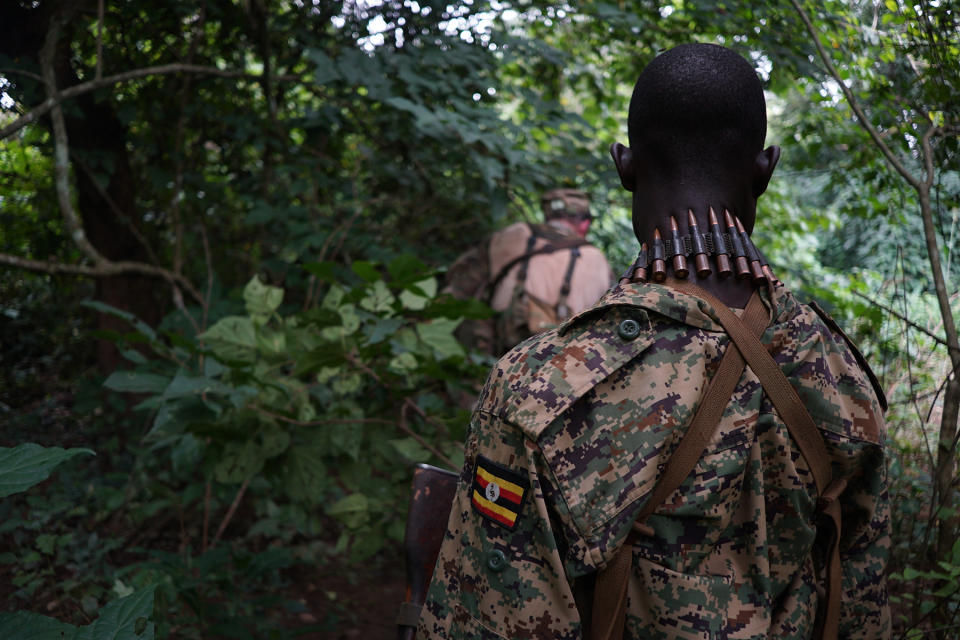 A Ugandan soldier accompanies U.S. Special Forces on foot patrol in Haute-Kotto Prefecture, Central African Republic, Sept. 15, 2016. The soldiers were part of an operation attempting to find the warlord Joseph Kony.