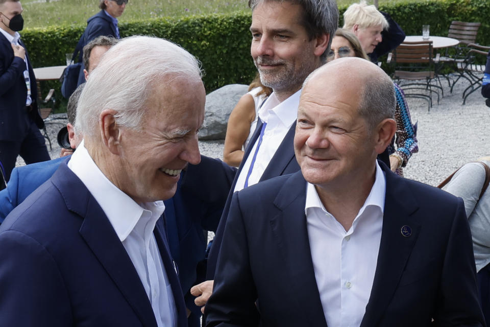 FILE - German Chancellor Olaf Scholz, front right, and U.S. President Joe Biden, front left, speak to each other at Castle Elmau in Kruen, Germany, Sunday, June 26, 2022. As chances rise of a Biden-Donald Trump rematch in the U.S. presidential election race, America’s allies are bracing for a bumpy ride. Scholz has said he is “currently on the phone a lot with my colleagues and asking them to do more” to support Ukraine amid concerns U.S. support could falter. (Jonathan Ernst/Pool Photo via AP, File)