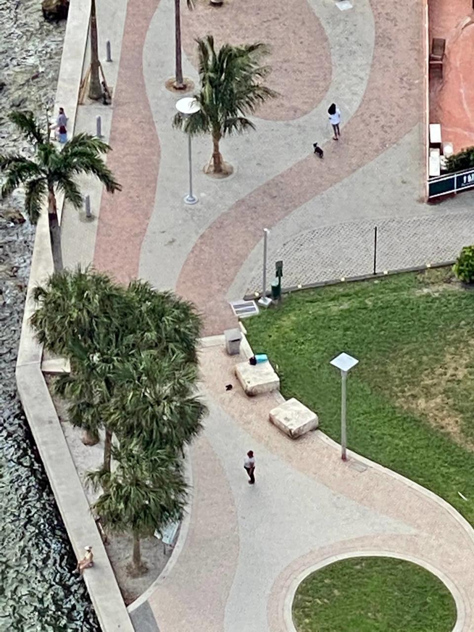 Jacqueline Nickelberry took this photo from a nearby building of a pregnant homeless woman she had met on March 28, 2020. She helped get the woman into Lotus House. The cement bench with the items on it is where they met. The turquoise squares on the bench are the towels Nickelberry brought to her on the first night. The black bag had the supplies and food Nickelberry brought for her for two days. The woman’s identity is obscured and she isn’t being identified.