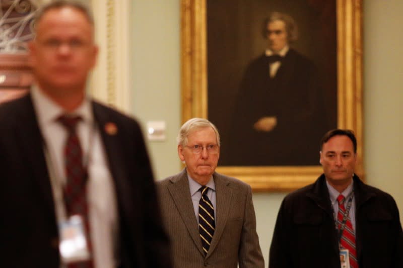 FILE PHOTO: U.S. Senate Majority Leader McConnell walks to his office at the U.S. Capitol in Washington