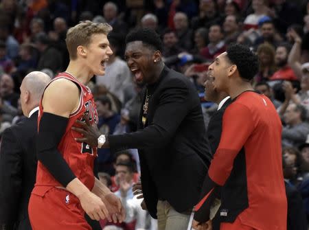 Dec 7, 2018; Chicago, IL, USA; Chicago Bulls forward Lauri Markkanen (24) celebrates with his teammates after scoring the go ahead basket against the Oklahoma City Thunder during the second half at United Center. David Banks-USA TODAY Sports