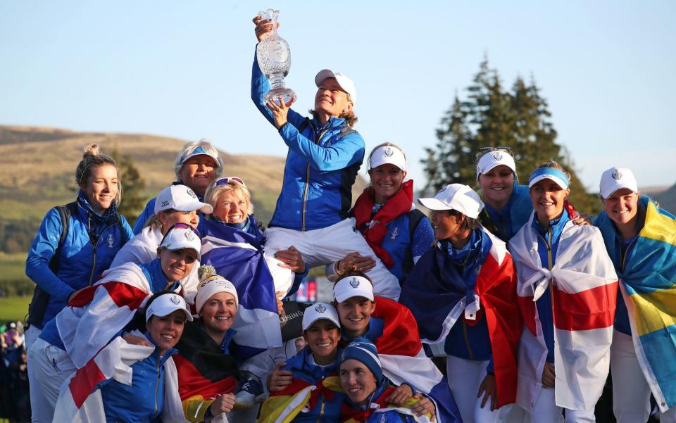 Team Europe captain Catriona Matthew (top) celebrates with her team - PA