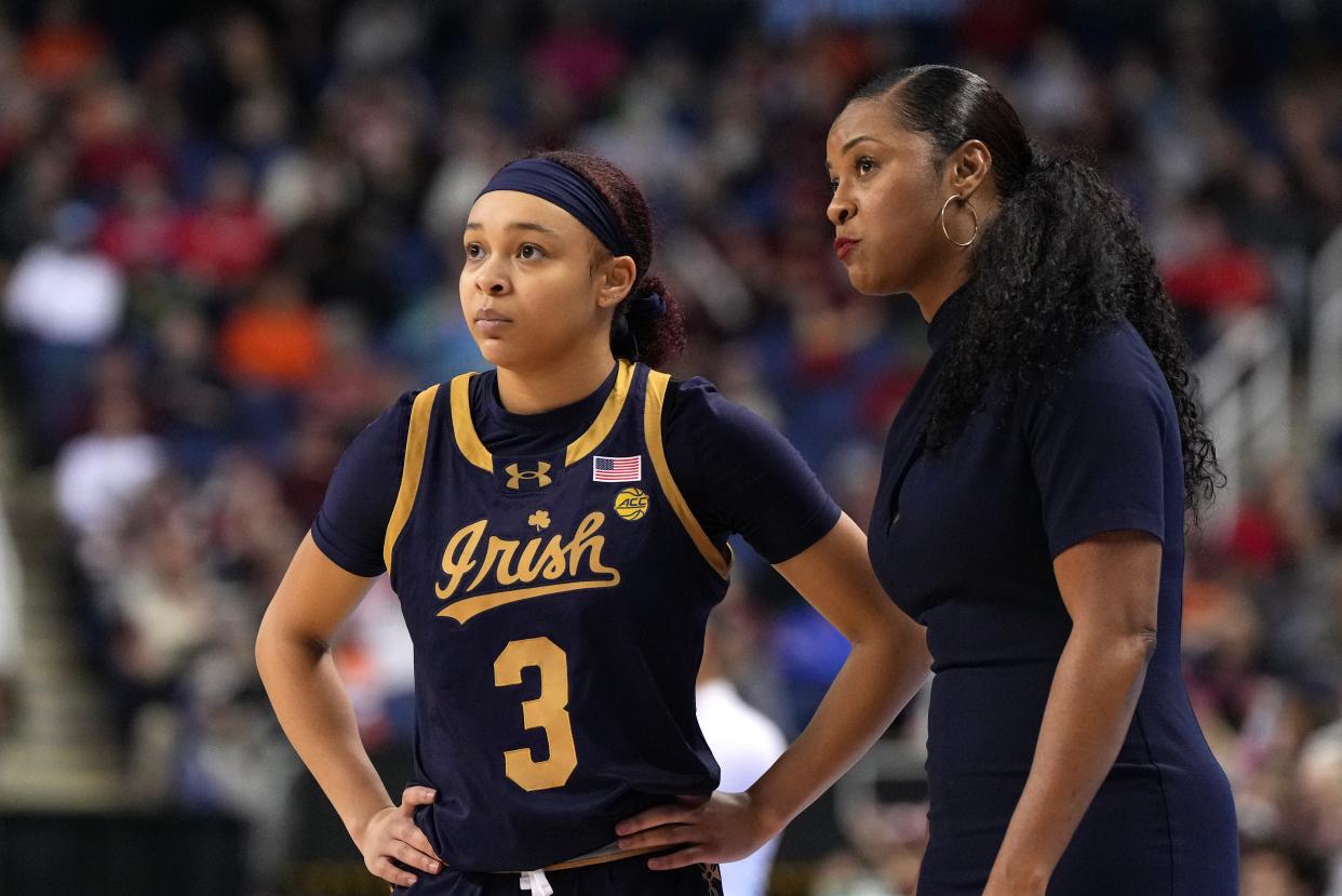 Notre Dame guard Hannah Hidalgo (3) and coach Niele Ivey on the sideline against Virginia Tech.