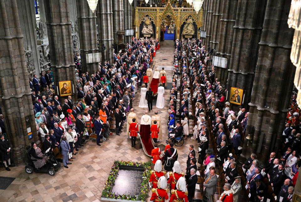 Queen Camilla and King Charles entered Westminster Abbey alongside their Pages of Honour. (Gareth Cattermole/Pool via REUTERS)