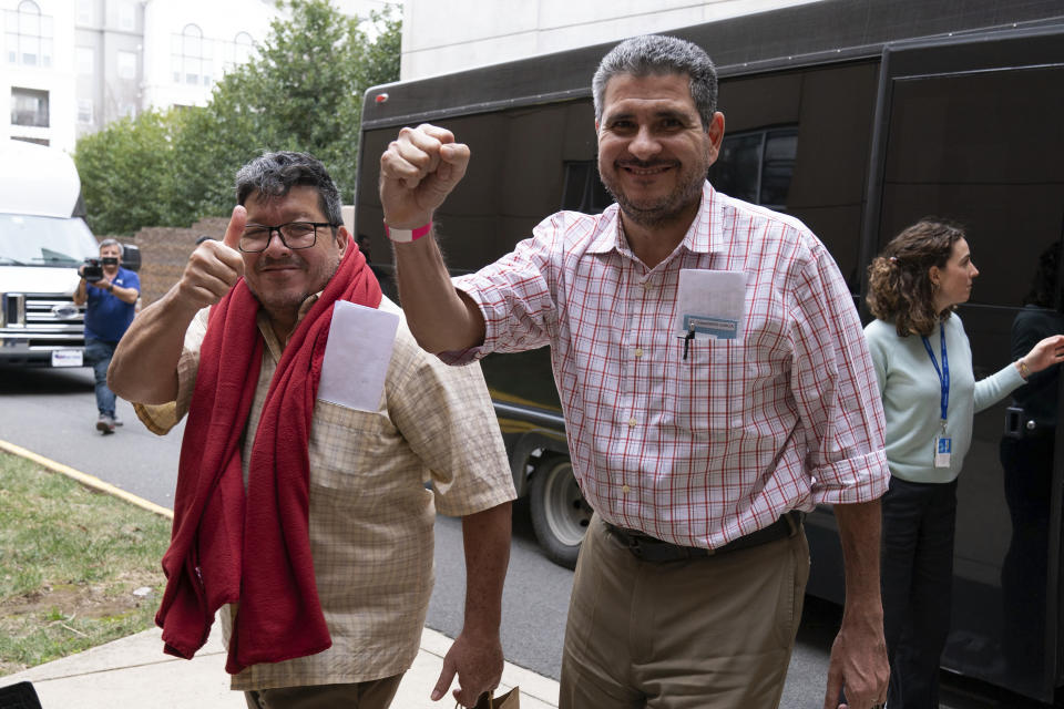 Nicaraguans Pedro Vazquez, left, and Juan Sebastián Chamorro, celebrate as they arrive to a hotel in Chantilly, Va., Thursday, Feb. 9, 2023, after flying in to the Washington Dulles International Airport. Vazquez and Chamorro were among some 222 prisoners of the government of Nicaraguan President Daniel Ortega who arrived in Washington on Thursday. (AP Photo/Jose Luis Magana)