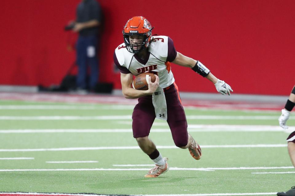 Canistota-Freeman QB Tage Ortman (3) rushes the ball  during the 9AA State Championship game against Platte-Geddes Thursday night at the Dakota Dome.  Platte-Geddes came away with the victory 14-8.