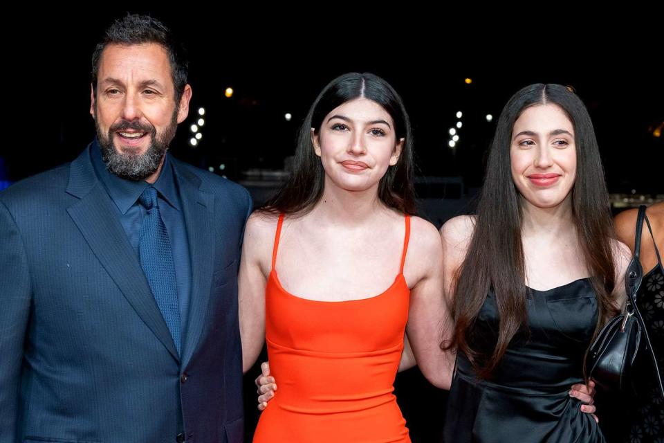 <p>Marc Piasecki/WireImage</p> Adam Sandler and daughters Sunny and Sadie in 2023