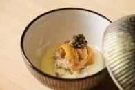 <p>Beloved Miami Michelin-starred omakase speakeasy <a href="https://www.sushi-azabu.com/" rel="nofollow noopener" target="_blank" data-ylk="slk:The Den;elm:context_link;itc:0;sec:content-canvas" class="link ">The Den</a> has opened its second location at the recently renovated and reopened Sushi Azabu in Tribeca. Like the original, The Den at Azabu is a hidden jewel box of a space with an eight-seat counter and 14-seat dining room. The minimalist and calming room, inspired by a Buddhist aesthetic, is the perfect backdrop for chef Toshihide Terado’s beautiful and unique take on traditional Edomae-style omakase. Seasonality drives most of the fish you see on the menu as Terado will only serve Japanese species that are at their best at any given point of the year. On a recent visit, diners were offered buri (Japanese amberjack), ankimo (monkfish liver), kegani (horsehair crab), shirako (cod milt), and sayori (Japanese halfbeak).</p><p>The Den Omakase ($320), served only at the counter, includes seasonal appetizers, a selection of nigiri, soup, and dessert at the end. In the dining room, guests can enjoy the Chef’s Omakase ($210) from Azabu upstairs, seasonal sashimi, a Toro tasting, yakimono (grilled dishes), chef’s choice nigiri, miso soup, and dessert. No matter which option you choose, a night out at The Den at Azabu feels like a magical trip to Tokyo.</p>