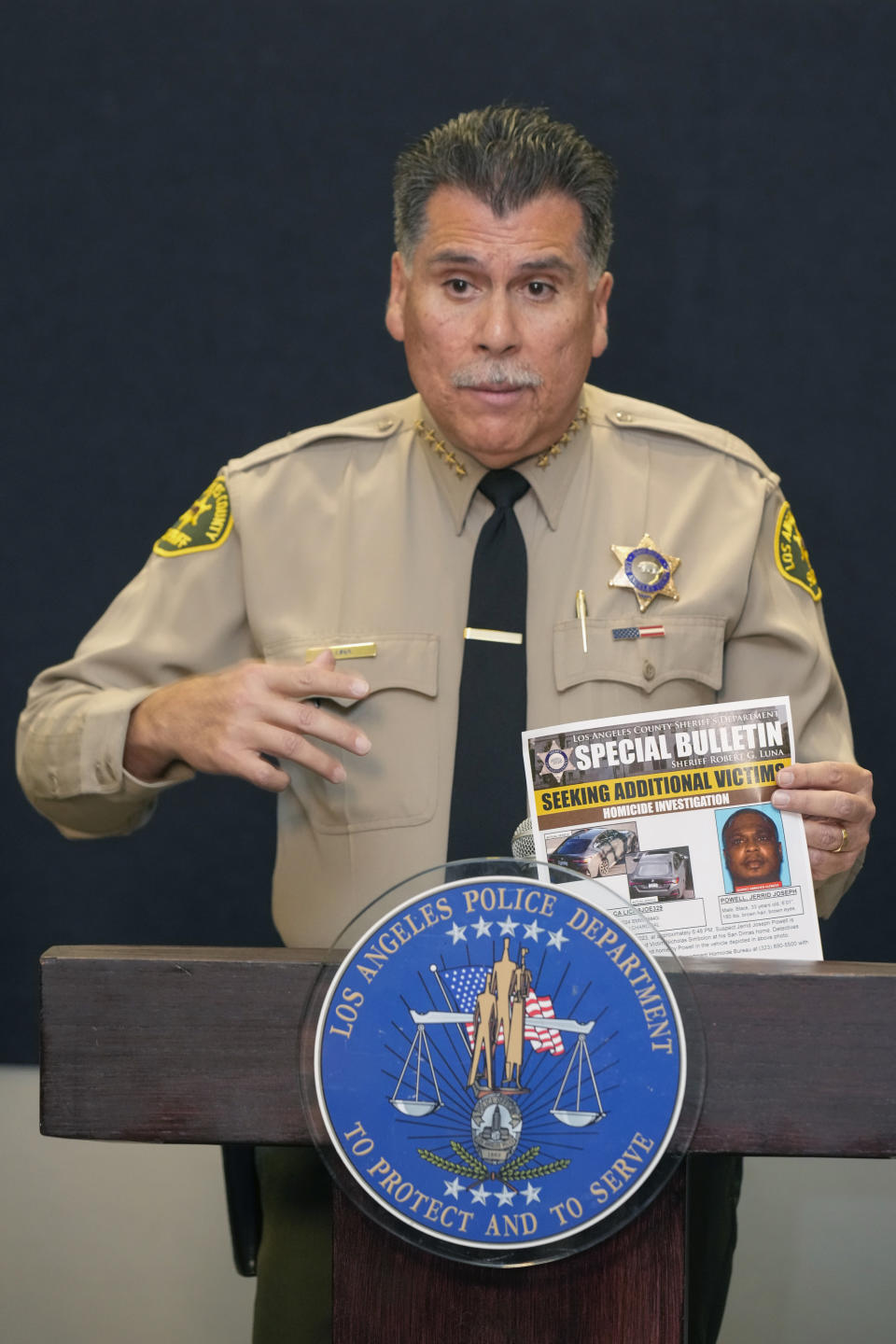 Los Angeles County Sheriff Robert Luna announces the arrest of a suspect in three recent killings of homeless men, on Saturday, Dec. 2, 2023, in Los Angeles. (AP Photo/Damian Dovarganes)