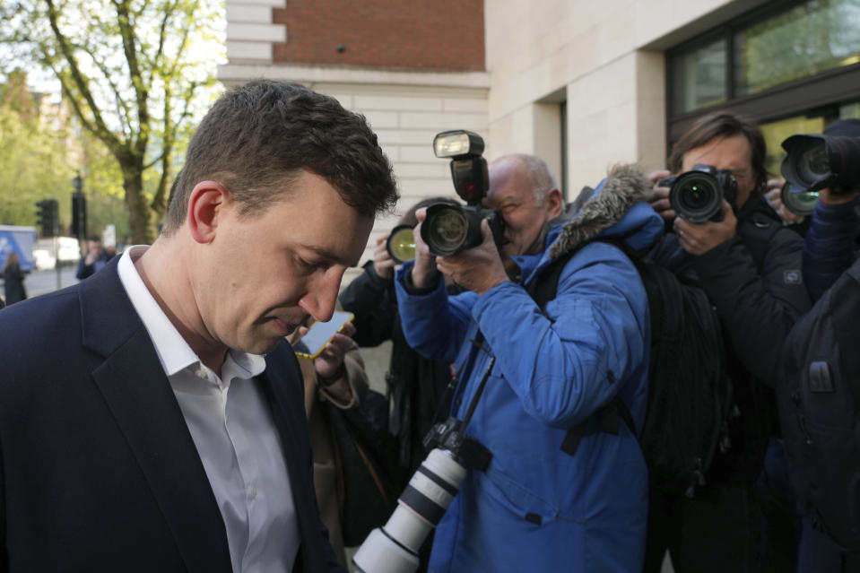 Former British parliamentary researcher Christopher Cash arrives at Westminster Magistrates' Court where he faces an Official Secrets Act charge related to allegedly gathering information for China, in London, Friday April 26, 2024. (Jeff Moore/PA via AP)