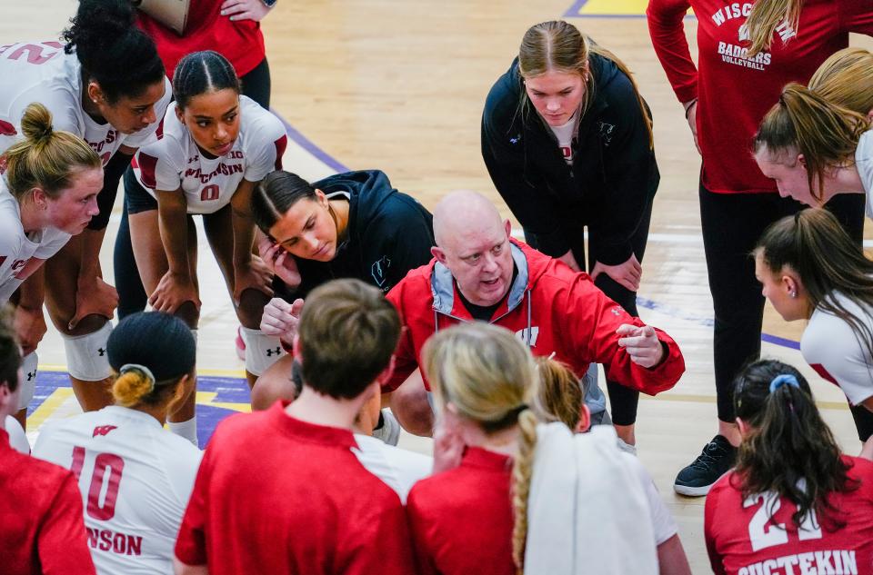 Wisconsin head coach Kelly Sheffield speaks with the players during the second set of their scrimmage against Marquette on March 31, 2023 at Oconomowoc High School. The Badgers will face Marquette in non-conference action Sept. 13 at Fiserv Forum.