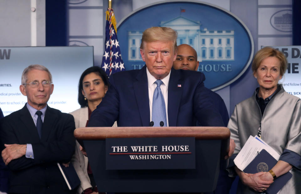 President Donald Trump holds a news briefing Monday on the coronavirus outbreak while accompanied by members of the coronavirus task force at the White House (Photo: Leah Millis/Reuters)