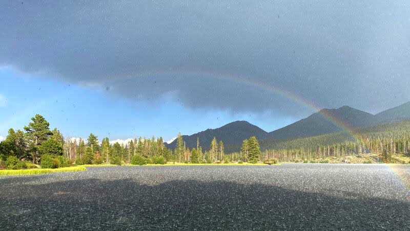 A rainbow appears during a summer hailstorm in Rocky Mountain National Park, July 31, 2020.