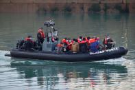 Migrants are brought to Dover harbour by Border Force, in Dover