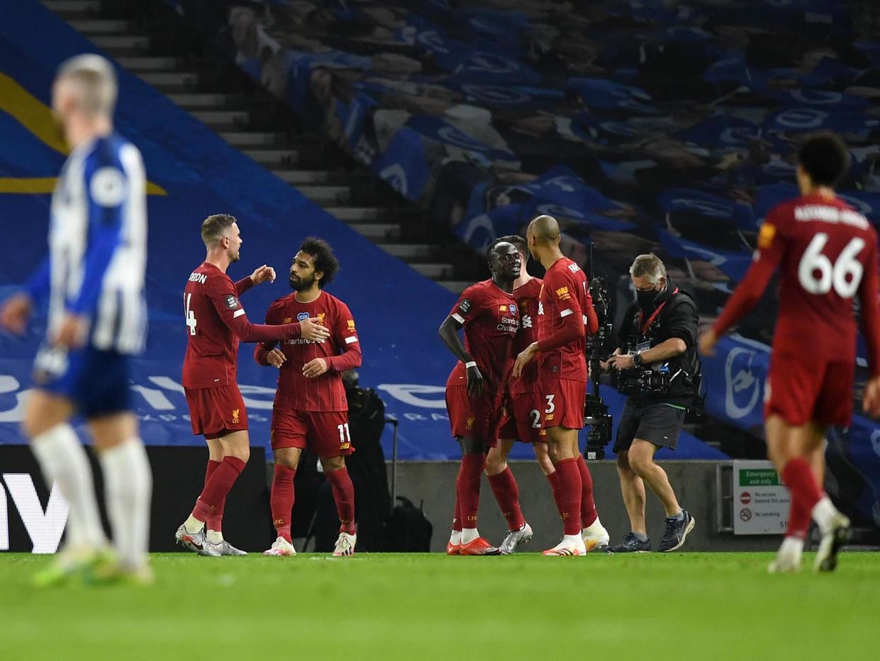 Liverpool celebrate Mohamed Salah's second and their third of the evening: Getty Images