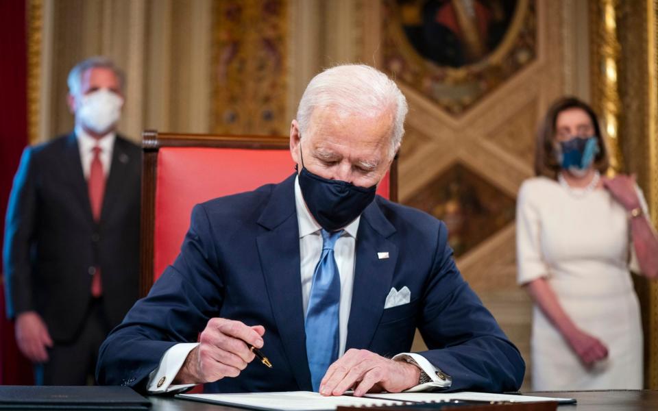 Joe Biden signs the Inauguration Declaration - EPA