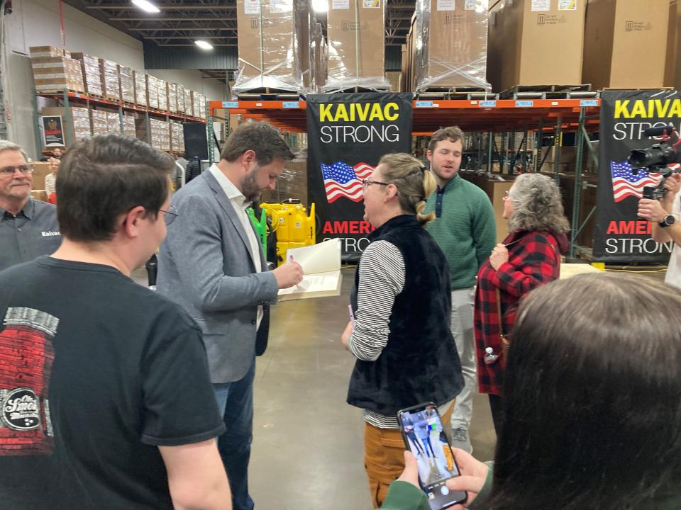 J.D. Vance signs a copy of his “Hillbilly Elegy” after a March campaign appearance in Hamilton.