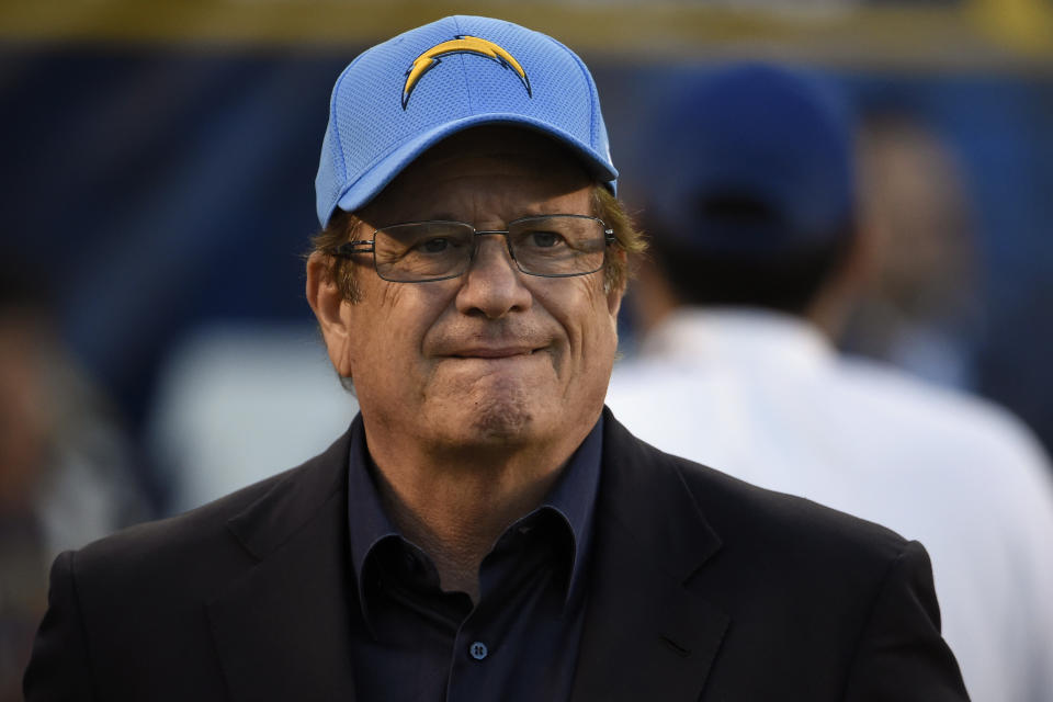 FILE - In this Dec. 18, 2016, file photo, San Diego Chargers team president and CEO Dean Spanos looks on during the second half of an NFL football game against the Oakland Raiders, in San Diego. The Chargers are moving to Los Angeles, where they will join the recently relocated Rams in giving the nation's second-largest media market two NFL teams for the first time in decades. The announcement was made Thursday, Jan. 12, 2017.(AP Photo/Denis Poroy, File)