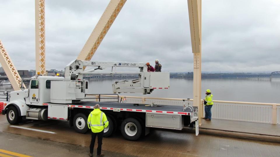 Kentucky Transportation Cabinet engineers inspect the George Rogers Clark Memorial Bridge over the Ohio River on March 2 following a multi-vehicle crash the day before that sent a semitruck over the side of the bridge, leading to a rescue that captured national attention.