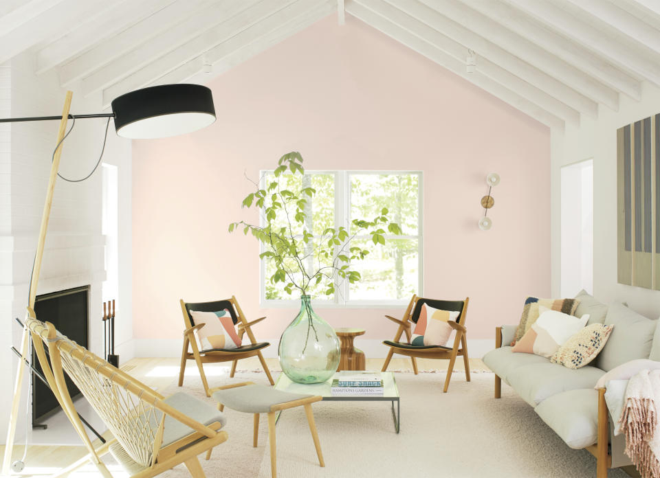 This photo provided by Benjamin Moore shows a room with Benjamin Moor'es 2020 Color of the Year called First Light, a dreamy, soft shade of pink. Director of Color Marketing & Development Andrea Magno says that while the color was already part of the 3500-hue library, "it's always fortuitous when the trend concept and color name complement one another. While descriptions like 'light pink' are quite straightforward, we also look for names that evoke positive associations and experiences." (Benjamin Moore via AP)