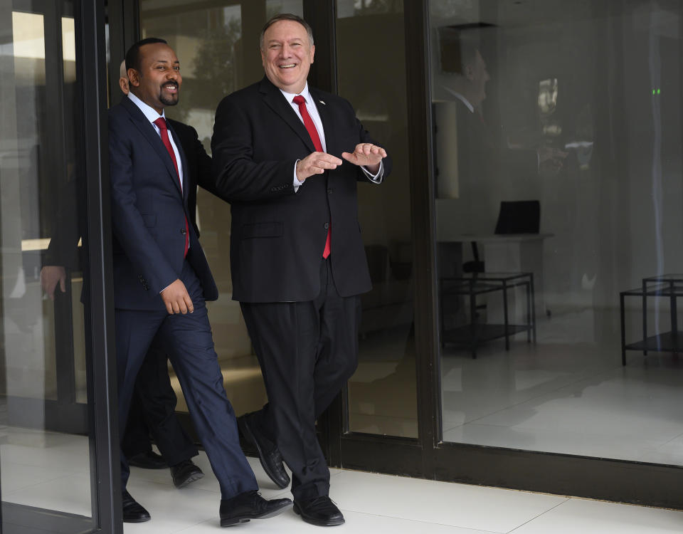 US Secretary of State Mike Pompeo, right, walks with Ethiopian Prime Minister Abiy Ahmed at the Prime Minister's office after a meeting in Addis Ababa, on Tuesday Feb. 18, 2020. Pompeo's visit to Africa is the first by a Cabinet official in 18 months. (Andrew Caballero-Reynolds/Pool via AP)