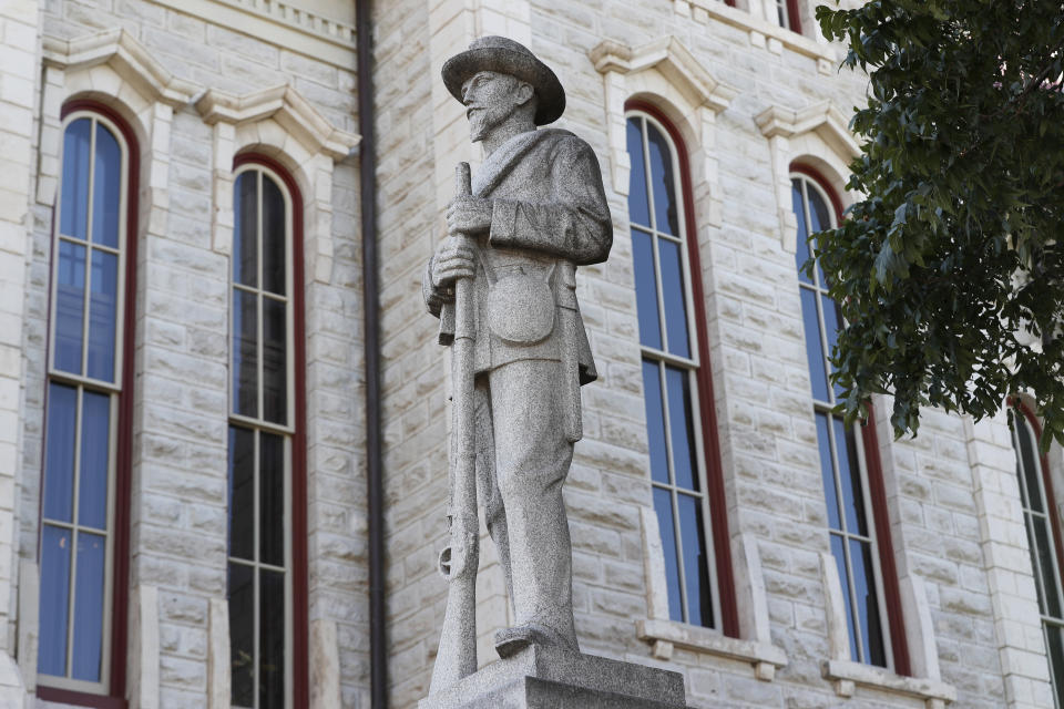 FILE - In the July 31, 2020 file photo a statue of a Confederate soldier sits outside the Parker County Courthouse in Weatherford, Texas. As a racial justice reckoning continues to inform conversations across the country, lawmakers nationwide are struggling to find solutions to thousands of icons saluting controversial historical figures. (AP Photo/Tony Gutierrez, File)