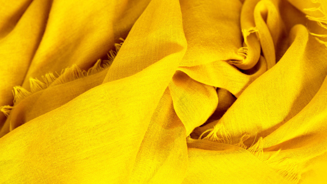 Close-up of lightweight yellow scarf