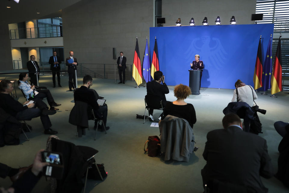 German Chancellor Angela Merkel speaks during a news conference, where journalist placed in distance, about the novel coronavirus outbreak and the German government measure to curb it at the chancellery in Berlin, Germany, Monday, March 16, 2020. For most people, the new coronavirus causes only mild or moderate symptoms, such as fever and cough. For some, especially older adults and people with existing health problems, it can cause more severe illness, including pneumonia.(AP Photo/Markus Schreiber, Pool)