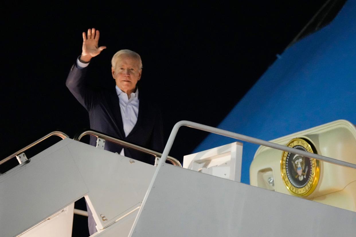 President Joe Biden waves as he boards Air Force One at Andrews Air Force Base, Maryland, on Dec. 27. Biden and his family traveled to St. Croix, U.S. Virgin Islands, to celebrate New Year's. St. Croix is a favorite vacation spot for the Bidens.