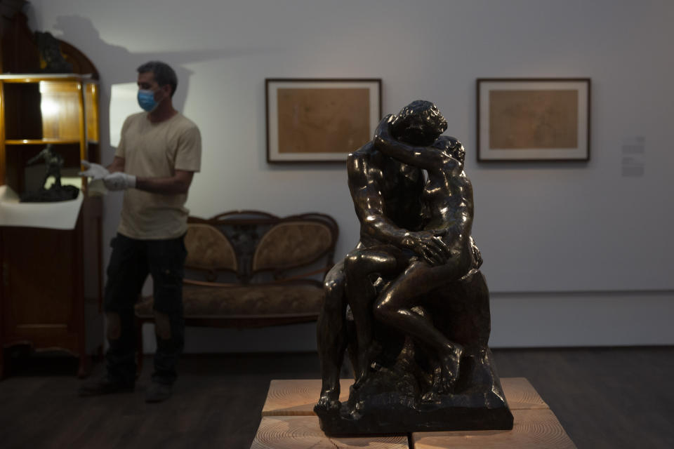 Auguste Rodin's "The Kiss," is on display in a gallery of the Israel Museum after five months in storage during closures due to the coronavirus pandemic, in Jerusalem, Tuesday, Aug. 11, 2020. The Israel Museum, the country's largest cultural institution, is returning the priceless Dead Sea scrolls and other treasured artworks to its galleries ahead of this week's reopening to the public. (AP Photo/Maya Alleruzzo)