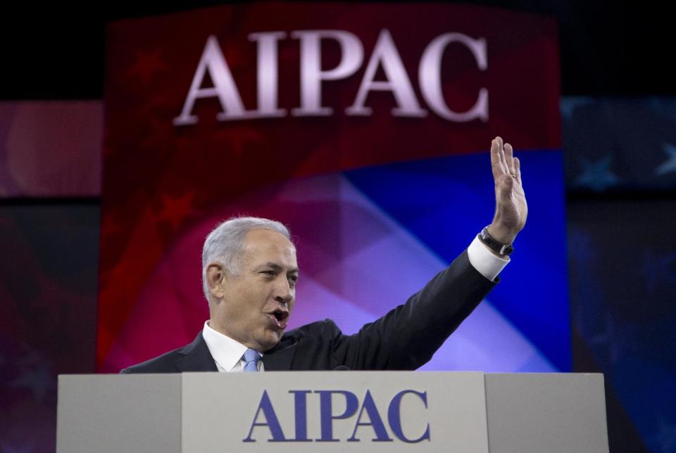 Israeli Prime Minister Benjamin Netanyahu waves to the cheering audience as he arrives to speak to the AIPAC meeting at the Washington Convention Center, Tuesday, March 4, 2014, in Washington. On Monday, the prime minister met with President Barack Obama at the White House. (AP Photo/Carolyn Kaster)