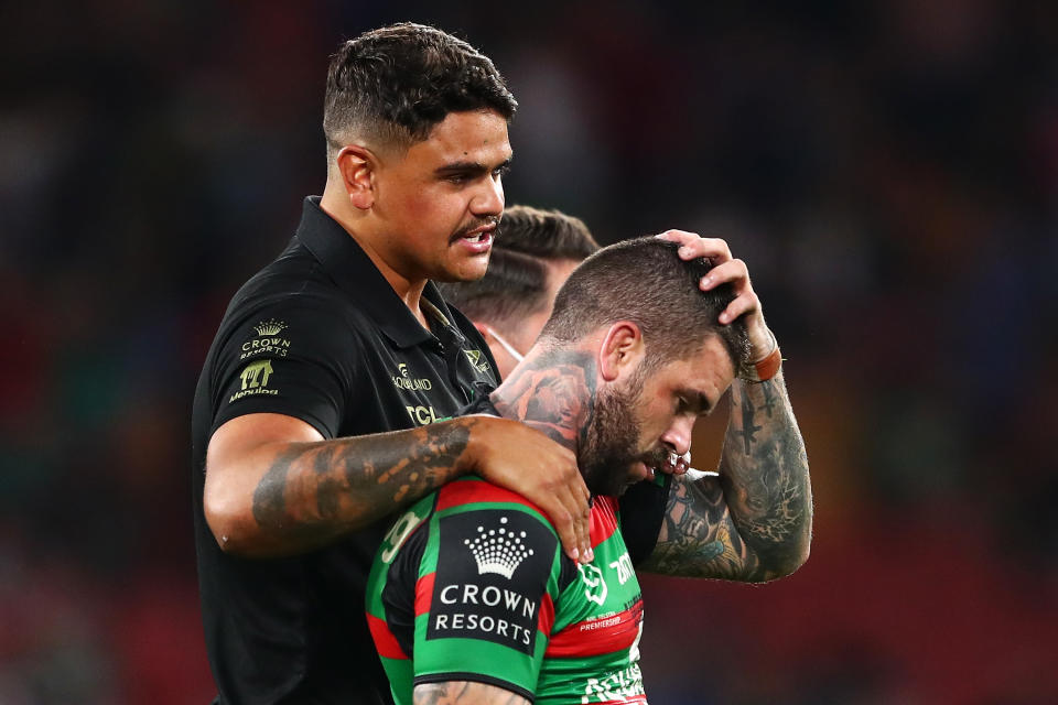 Adam Reynolds (pictured right0 is comforted by suspended team mate Latrell Mitchell (pictured left) as he looks dejected after defeat in the 2021 NRL Grand Final.
