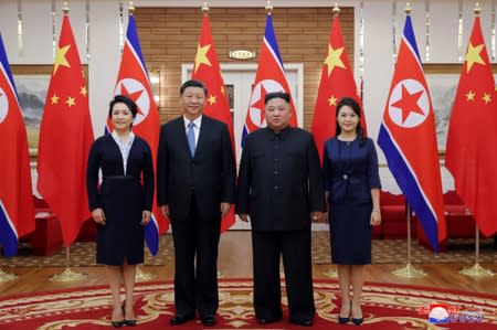 North Korean leader Kim Jong Un and China's President Xi Jinping pose for photo during Xi's visit in Pyongyang, North Korea in this undated photo released on June 21, 2019 by North Korea's Korean Central News Agency (KCNA)