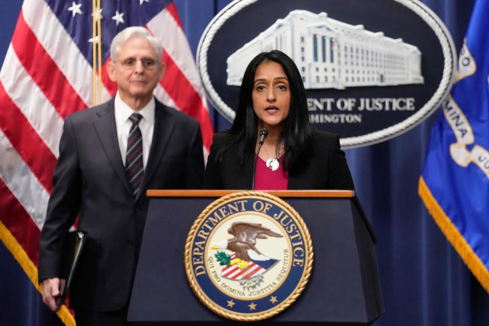 Associate Attorney General Vanita Gupta, joined by Attorney General Merrick Garland, speaks at the Department of Justice in Washington, Tuesday, Jan. 24, 2023. The Justice Department and several states have sued Google, alleging that its dominance in digital advertising harms competition.