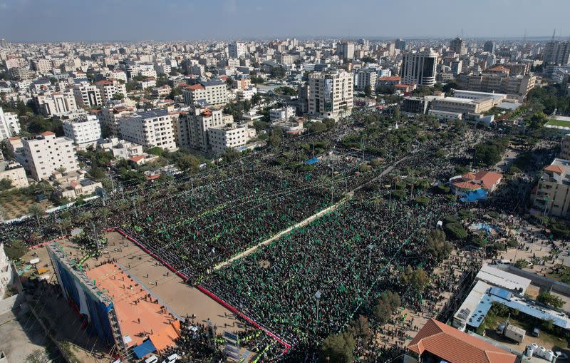 Palestinian Hamas supporters attend a rally marking the 35th anniversary of the movement founding, in Gaza City