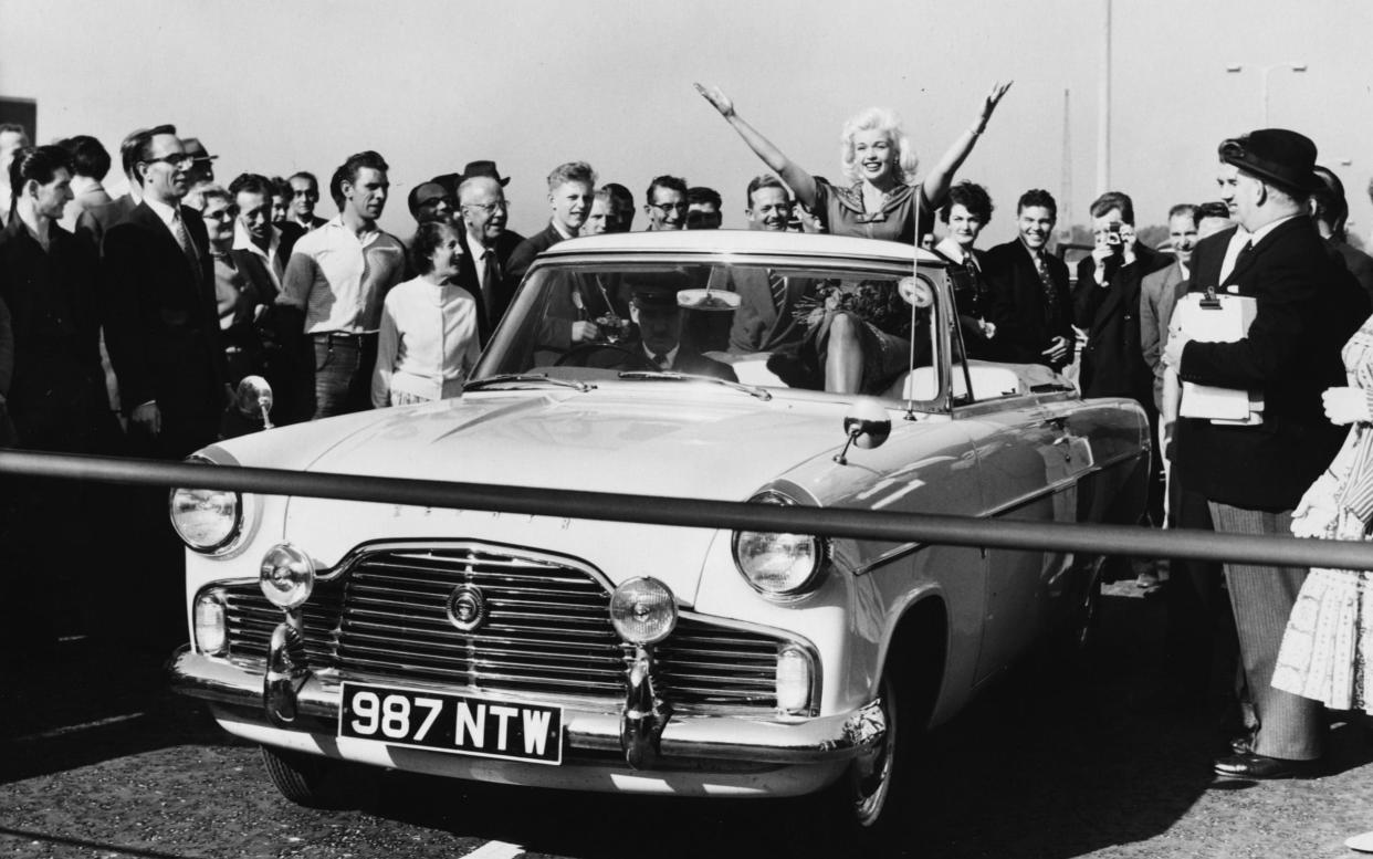 Hollywood star Jayne Mansfield brings an unlikely touch of glamour to west London's major road project in 1959 as she arrives in a Ford Zephyr Mk2 Convertible - Hulton Archive