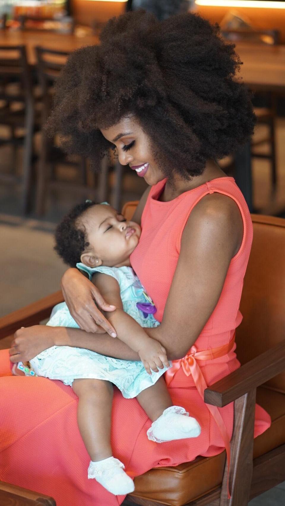 Janay Flowers says a nurse traveling onboard an American Airlines flight treated her baby Nevaeh's seizure. (Photo: William Stambaugh)