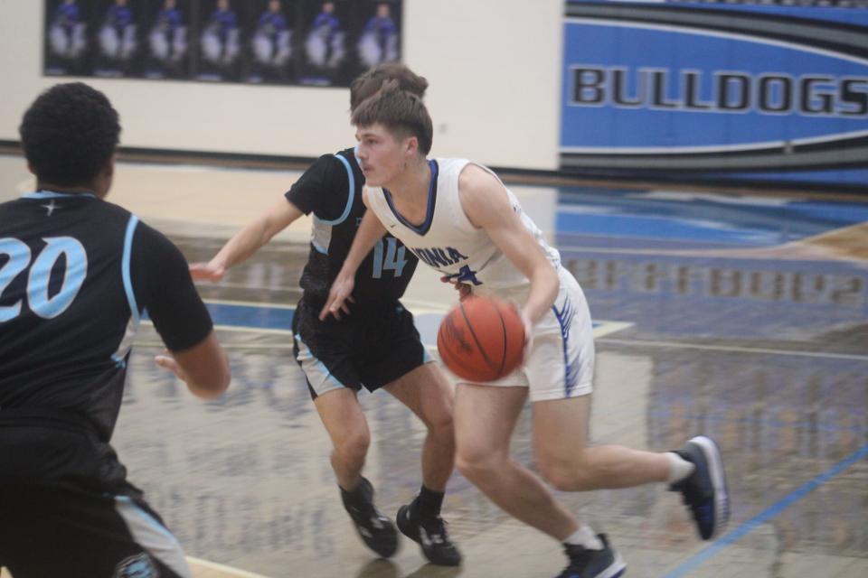 Ionia junior forward Max Doty drives to the rim against the Lansing Catholic defense during a boys varsity basketball game Friday, Jan. 27, at Ionia High School. Ionia won the game, 57-43.