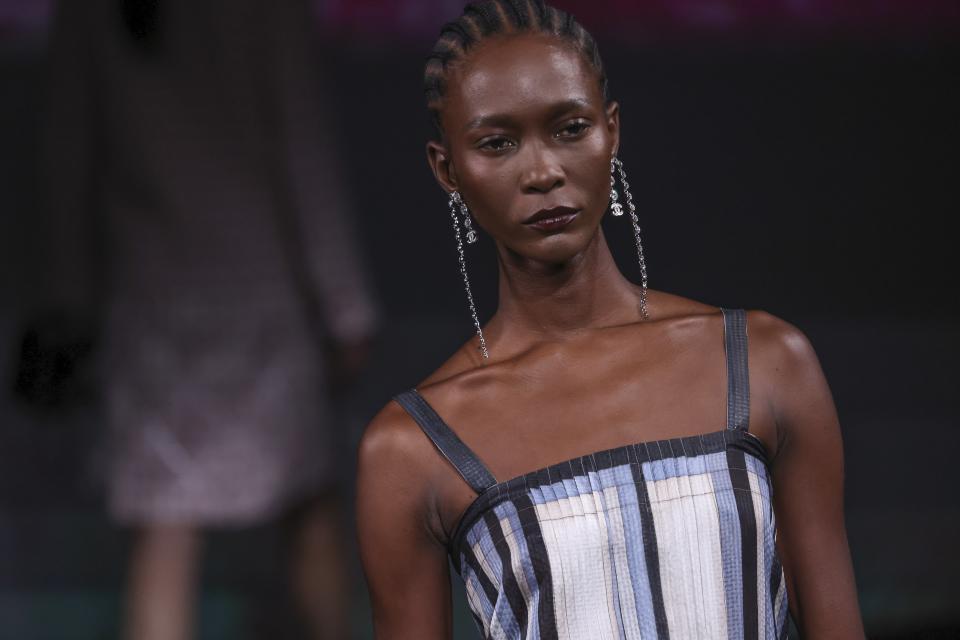 A model wears a creation for the Chanel ready-to-wear Spring/Summer 2023 fashion collection presented Tuesday, Oct. 4, 2022 in Paris. (Photo by Vianney Le Caer/Invision/AP)